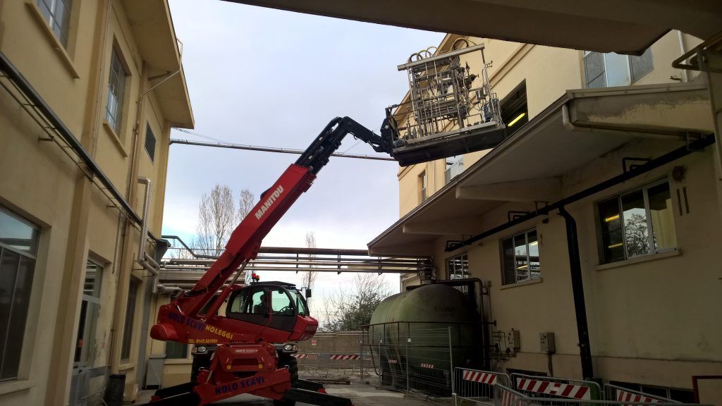 Plant Relocation Removal of equipment through a window using a crane