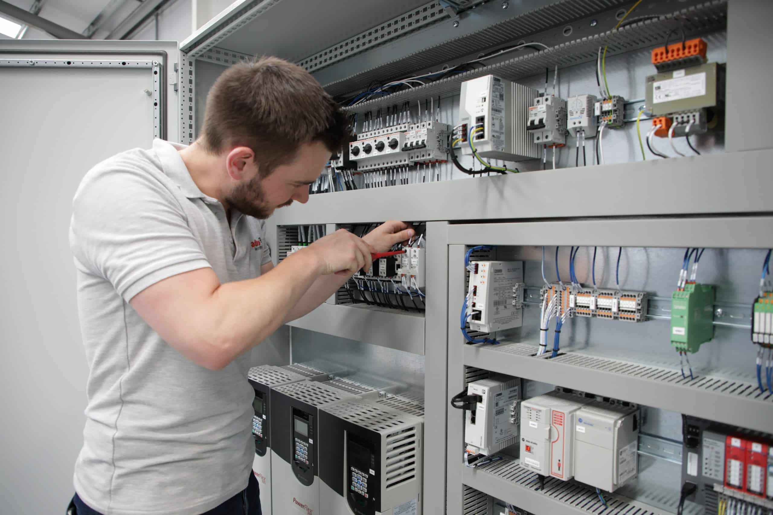 In house control panel build An engineer from adbro controls installing components in a control panel